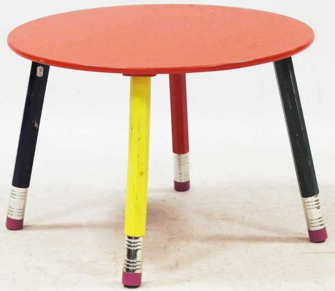 Small round table with pencils as legs