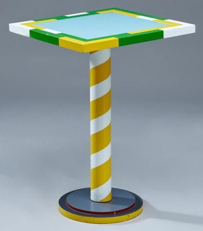 Yellow, white and green table supported by a single striped pole on a base