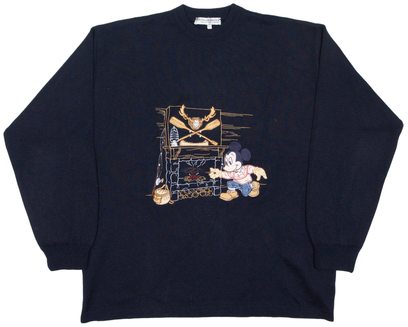 A blue jumper with an embroidered Mickey cooking fish in a fireplace