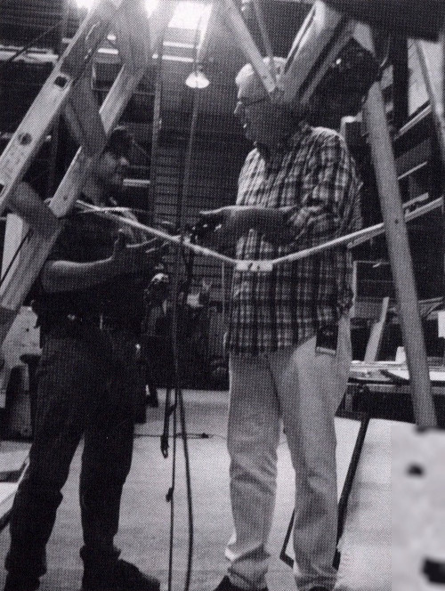 Two designers talking in a storage building