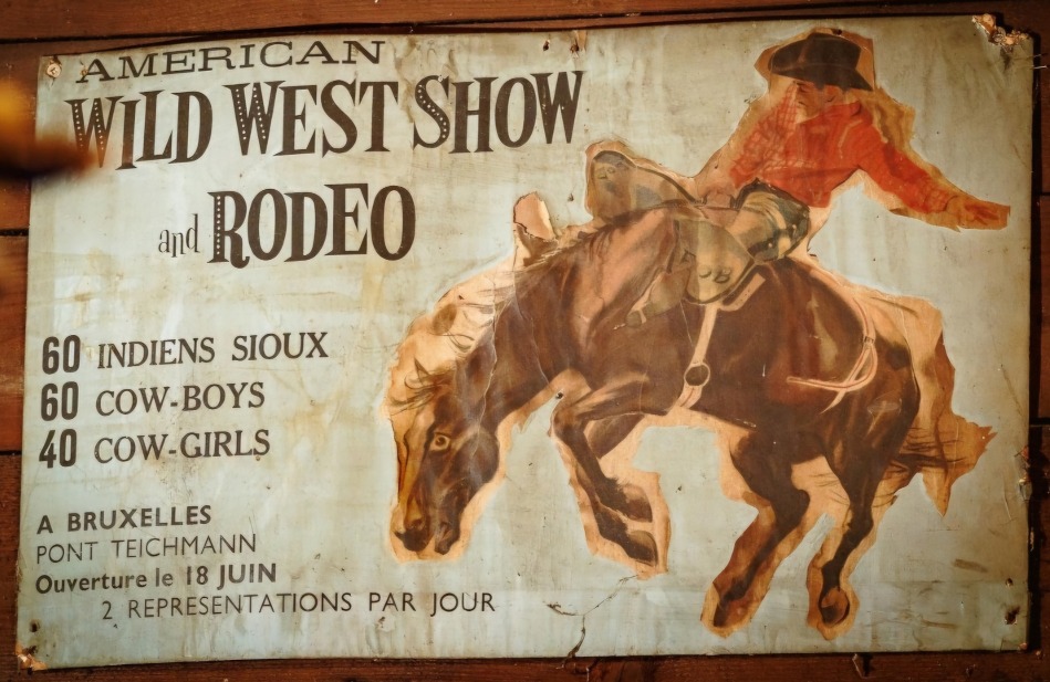A poster for a Wild West Show and Rodeo, with an illustration rodeo cowboy.